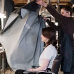 Home Hair stylist preparing client for a haircut in an upscale salon.